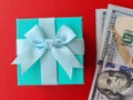 Dollar banknotes and surprise gift box closeup Royalty Free Stock Photo