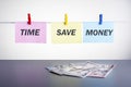 Dollar banknotes and text TIME SAVE MONEY Royalty Free Stock Photo