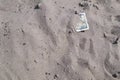100 dollar bill buried in the sand Royalty Free Stock Photo