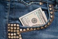 Dollar bill in the front pocket of blue jeans. Money in your pocket, cash. Royalty Free Stock Photo