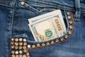 Dollar bill in the front pocket of blue jeans. Money in your pocket, cash. Royalty Free Stock Photo