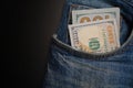 Dollar bill in the front pocket of blue jeans. Money in your pocket, cash. Royalty Free Stock Photo