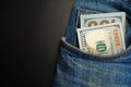 Dollar bill in the front pocket of blue jeans. Money in your pocket, cash. Royalty Free Stock Photo