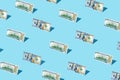 100 dollar bill izometric pattern on bright light blue background. Royalty Free Stock Photo