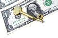 Dollar bill and key Royalty Free Stock Photo