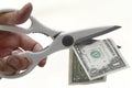 US One Dollar bill being cut with scissors Royalty Free Stock Photo