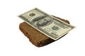 Dollar bill on a slice of bread