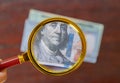 Dollar bill under a magnifying glass Royalty Free Stock Photo