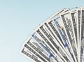 Dollar bills closeup on a blue background. Royalty Free Stock Photo