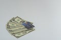 Dollar bills and credit cards are placed on a white background Royalty Free Stock Photo