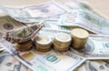 Dollar bills laid out on the table. A dollar boat on the smallest column of coins, four columns of coins, financial Royalty Free Stock Photo