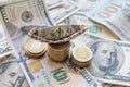 Dollar bills laid out on table. A ship made of dollars, three columns of coins, financial crisis, money, finances Royalty Free Stock Photo