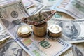 Dollar bills laid out on table. A ship made of dollars, three columns of coins, financial crisis, money, finances Royalty Free Stock Photo