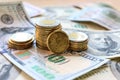 Dollar bills laid out on table. Three different columns of coins, 20 cents coin, financial crisis, money, finance Royalty Free Stock Photo