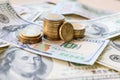 Dollar bills laid out on table. Three different columns of coins, 20 cents coin, financial crisis, money, finance Royalty Free Stock Photo