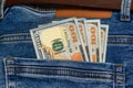 100 dollar bills in the pocket of blue jeans, studio shooting Royalty Free Stock Photo