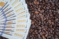 The 100 dollar bills are on roasted coffee beans. The concept of rising food prices Royalty Free Stock Photo