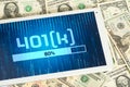 Dollar bills, tablet pc and 401k annuity plan Royalty Free Stock Photo