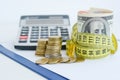 Dollar bills tied up with yellow measuring tape suggesting measurement of financial status Royalty Free Stock Photo