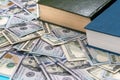 Dollar and book on blue Royalty Free Stock Photo