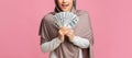 Dollar cash in hands of unrecognizable muslim woman in hijab Royalty Free Stock Photo