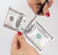 100 dollar cut with scissors on white Royalty Free Stock Photo