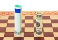 Dollar and euro on chess board Royalty Free Stock Photo