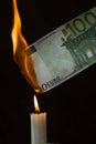 Dollar inflation concept, 100 dollars banknote burns in fire, US currency depreciation