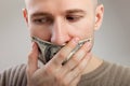 Dollar money gag shut voiceless men Royalty Free Stock Photo