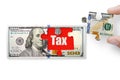 100 dollar note isolated on a white background. Puzzle with word tax Royalty Free Stock Photo