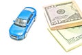 Dollar notes and blue car Royalty Free Stock Photo