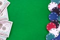 Dollar notes and poker chips on green felt background