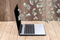 Dollar pouring out from a notebook computer Royalty Free Stock Photo