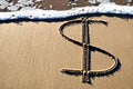 Dollar sign on sand