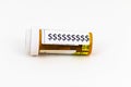 Dollar signs on a prescription pill bottle with a white background Royalty Free Stock Photo