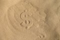 Dollar Silhouette on the sand Royalty Free Stock Photo