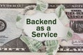 The dollar is torn in the center. In the center it is written - Backend as a Service