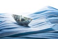 Dollar tosses on the waves. Financial problems concept, banknote origami ship with surgical masks. Royalty Free Stock Photo