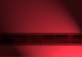 35mm movie Film in red light Red light reel of film Royalty Free Stock Photo