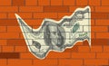 The dollar on wall of bricks