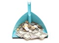 Dollars banknote with coins in blue dustpan Royalty Free Stock Photo