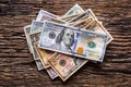 Dollars banknotes closeup on rustic oak table. Cash Money American Dollars.Close-up view of stack of US dollars Royalty Free Stock Photo