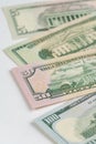5, 20, 50, 100 dollars banknotes at different angles. Close up of dollars on white background. Royalty Free Stock Photo
