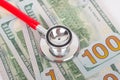 100 dollars banknotes and stethoscope, economic crisis concept Royalty Free Stock Photo