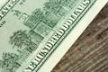 100 dollars banknotes on wooden background Royalty Free Stock Photo