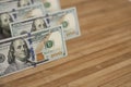 100 Dollars bill and portrait Benjamin Franklin on USA money banknote. Hundred dollar bills on wooden background Royalty Free Stock Photo