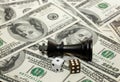 Dollars, chess pieces, dice. The concept of risk and loss Royalty Free Stock Photo