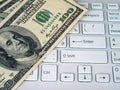 Dollars and computer Royalty Free Stock Photo