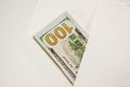 Dollars in a conwind on white background, a lot of money in an envelope. Royalty Free Stock Photo
