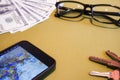 Dollars, glasses, phone and purse, preparation for travel Royalty Free Stock Photo